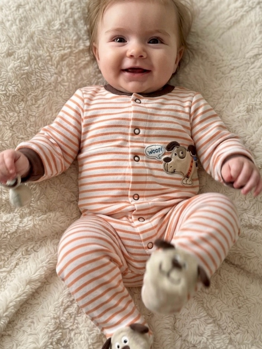 Cute as a button onesie with doggie print